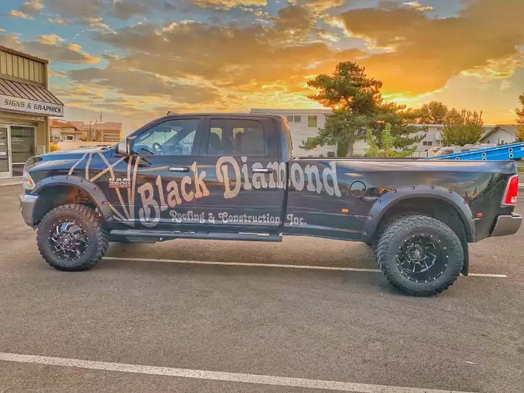 Black Diamond's black dually pickup wrapped with the company's diamond logo