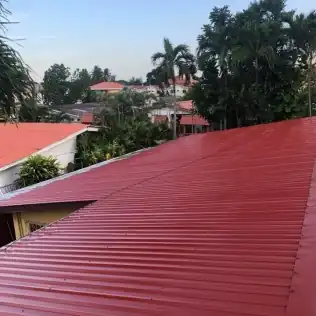 The finished red roof on the ministry home in Honduras